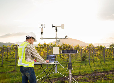 Man with tech in field CLIMATE CAMPAIGN ONLY.jpg